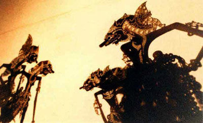 Wayang Kulit puppets behind screen